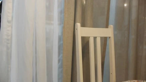 White screened window and high-backed wooden chair in the room Stock Footage 162234822
