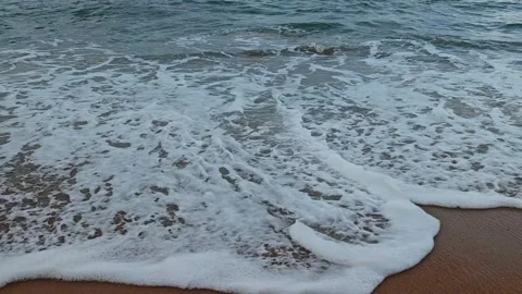 White Sea Foam on Sandy Beach Video stock 334643740