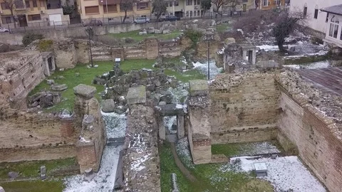 White seagull flying over ancient roman ruins in winter Stock Footage 346409870