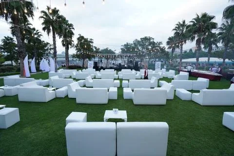 White seats at outdoor event Stock Photos