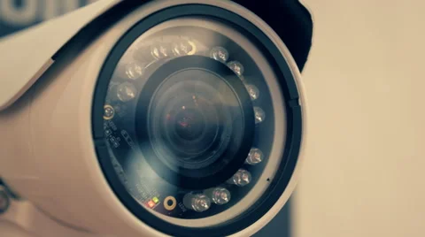 White security camera is checking the surrounding area in search of the offender Stock Footage 68370745