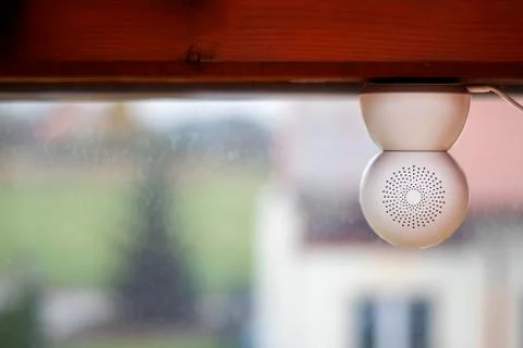 White security camera facing outside the window Stock Photos