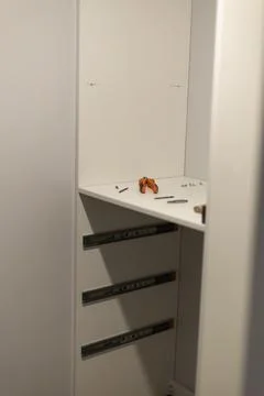 White server rack with hardware components and small tools Stock-Fotos