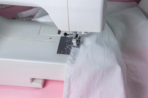 White sewing machine on a pink background. Electric sewing machine. Handmade too Stock Photos