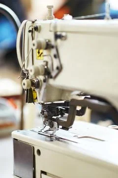 White sewing machine with threads Stock Photos