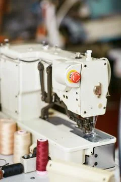 White sewing machine with threads Stock Photos