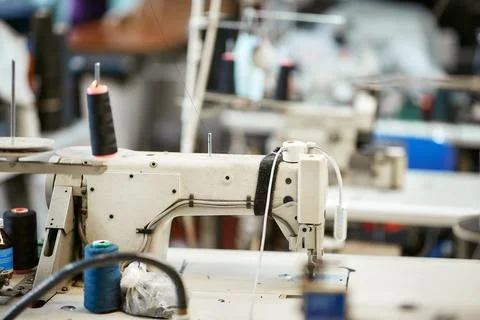 White sewing machine with threads Stock Photos