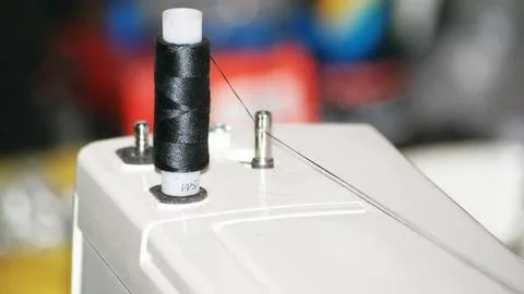 White sewing machine on the work table Stock Photos