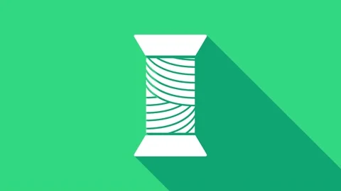 White Sewing thread on spool icon isolated on green background. Yarn spool Stock Footage 146742039