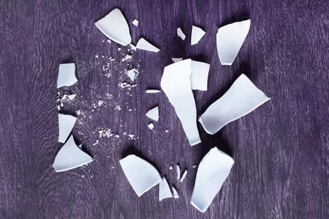 White Shards of a Broken Plate on the  background. splinters of a shattered.. Stock Photos