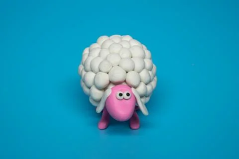 White Sheep on Blue BG Stock Photos