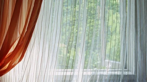 White sheer curtain blowing in the wind 動画素材 78491064