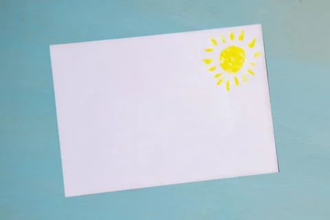 White sheet of paper on a blue background with a place for the inscription an Stock Photos