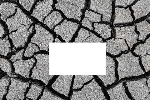 White sheet of paper lies on dry cracked ground, global warming Stock Photos
