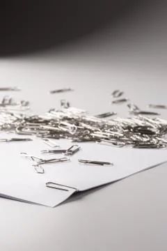 White sheet of paper for notes and paper clip Stock Photos