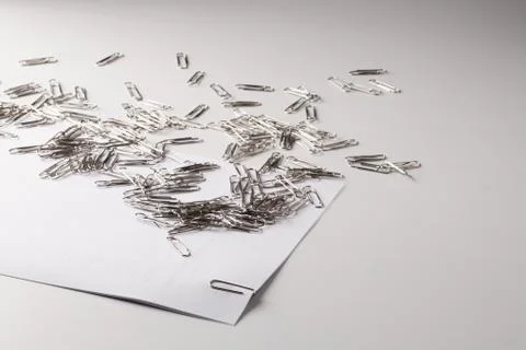 White sheet of paper for notes and paper clip Stock Photos