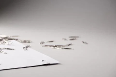 White sheet of paper for notes and paper clip Stock Photos