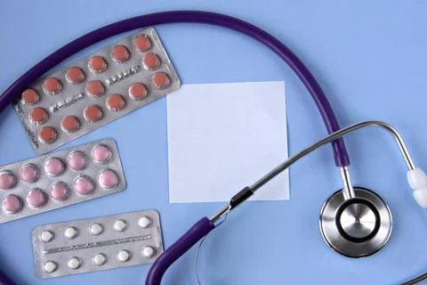A white sheet of paper for notes on a medical theme against the background of Stock Photos