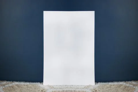 A white sheet of paper stands vertically Stock Photos