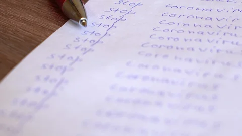 A white sheet spray-painted with the words "Stop the coronavirus" Stock Footage 127923207