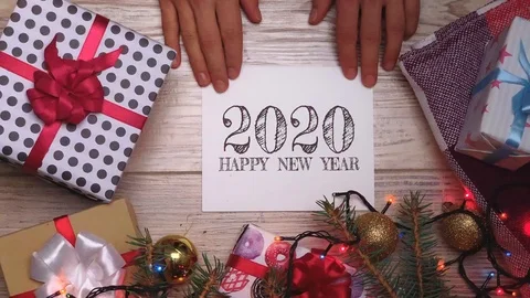 White sheet with text. 2020. Presents for the family. Beautiful presents under Video stock 116042399