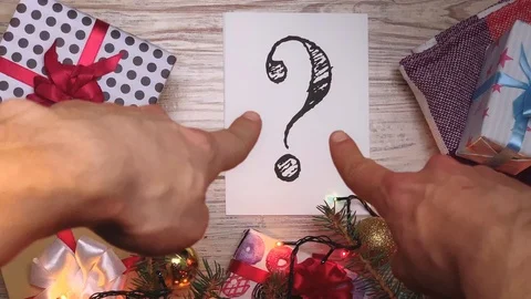 White sheet with text. Question mark. Presents for the family. Beautiful present Stock Footage 116042304