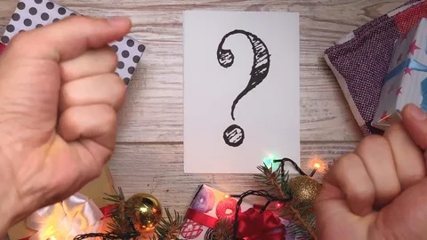 White sheet with text. Question mark. Presents for the family. Beautiful present Stock-Footage 116042346