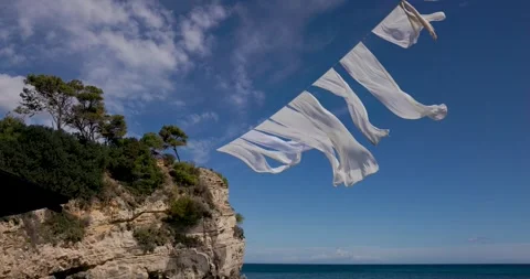 White sheets waving in the wind Stock Footage 275594378