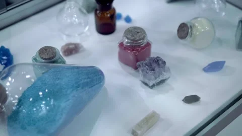 On a white shelf in a chemistry lab are samples of chemical reagents in flasks Stock Footage 340630157
