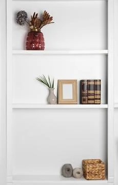 White shelving unit with different decor elements. Interior design Foto stock