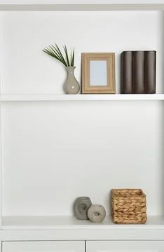 White shelving unit with different decor elements. Interior design Foto stock