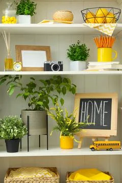 White shelving unit with different decorative elements 写真素材
