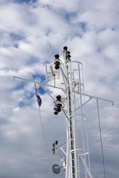 White Ship Mast With Navigation Lights Against Cloudy Blue Sky, Croatian Flag Stock Photos