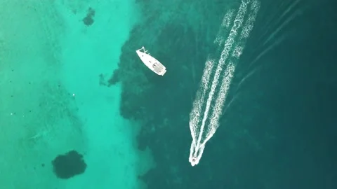 A white ship is moving quickly along the water surface of the river. Stock Footage 136232888