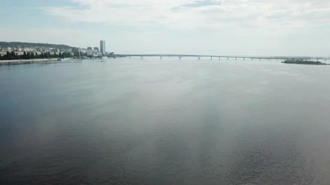 A white ship is moving quickly along the water surface of the river. Stock-Footage 138036167