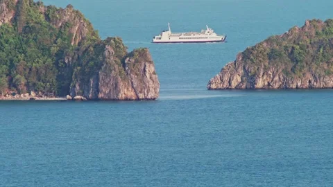 White Ship Passing Behind Tropical Islands on Blue Sea Видео 333547362