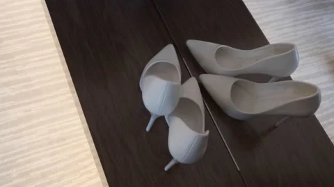 White shoes on a warm background close-up Stock Footage 168570653