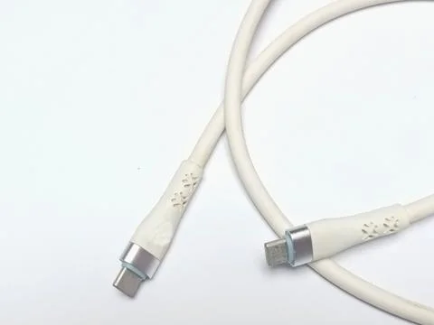 White Silicone USB C Fast Charging Cable Coiled on Background Stock Photos