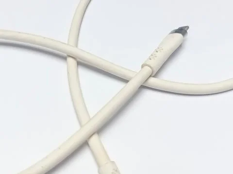 White Silicone USB C Fast Charging Cable Coiled on Background Stock Photos