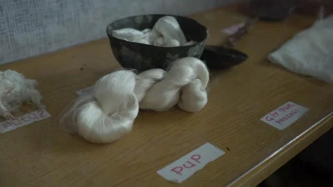 White silk pup thread pattern for for weaving a kalaghayi Stock Footage 248830705