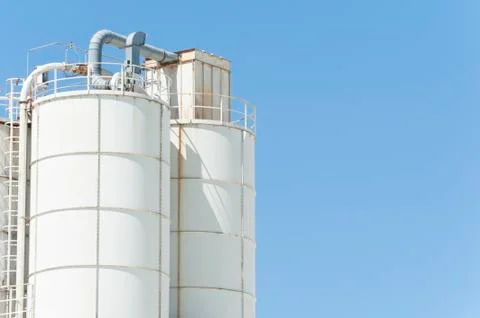 White silos for lime Stock Photos