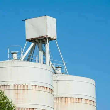 White silos for the storage Stock Photos