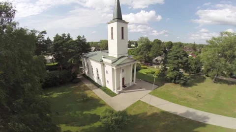 White Simple Church in a Medium-Sized Village Ikskile Stock Footage 260472130