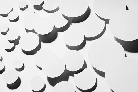 White simple geometric background with flying ovals in hard light with contra Foto stock