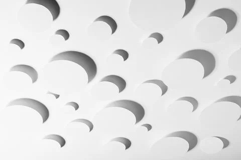 White simple geometric background with flying ovals in hard light with contra Foto stock