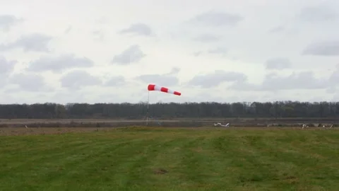 A white single-engine light plane takes off from the runway. Video stock 201506718