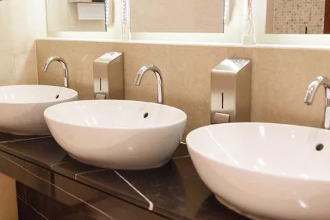 White sinks with taps Stock Photos
