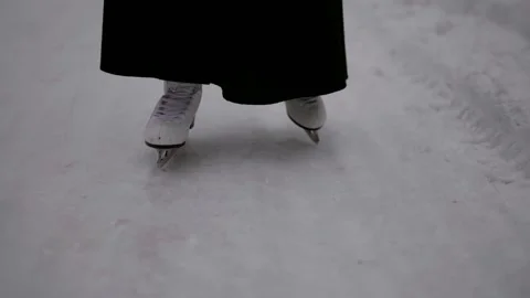 White skates glide through the fresh snow,  스톡 동영상 297601642
