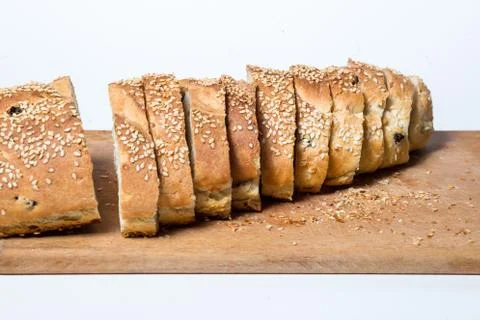 White sliced bread on kitchen board Stock Photos