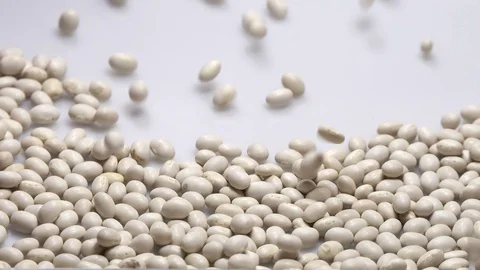 White small bean on white background falling from top and filling up frame. Stock Footage 108131987